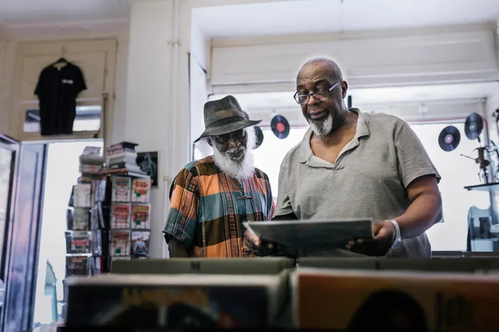 Two people browsing records