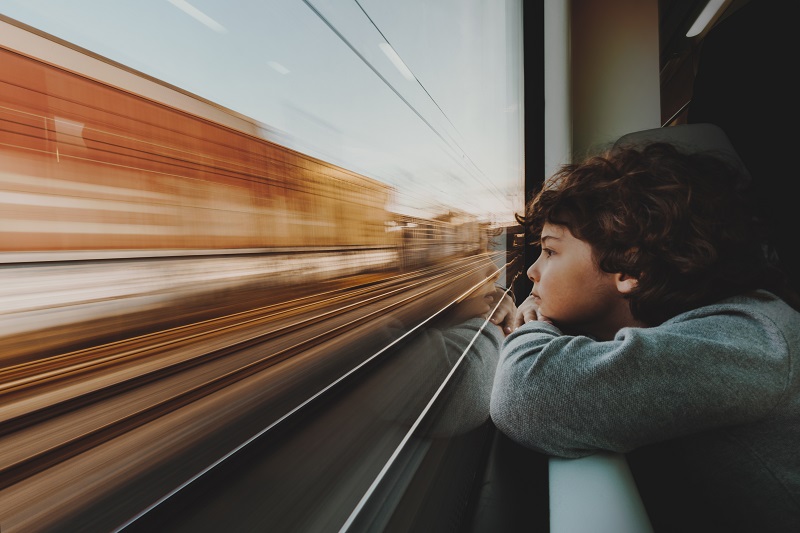 Child Looking Out Of Train Window