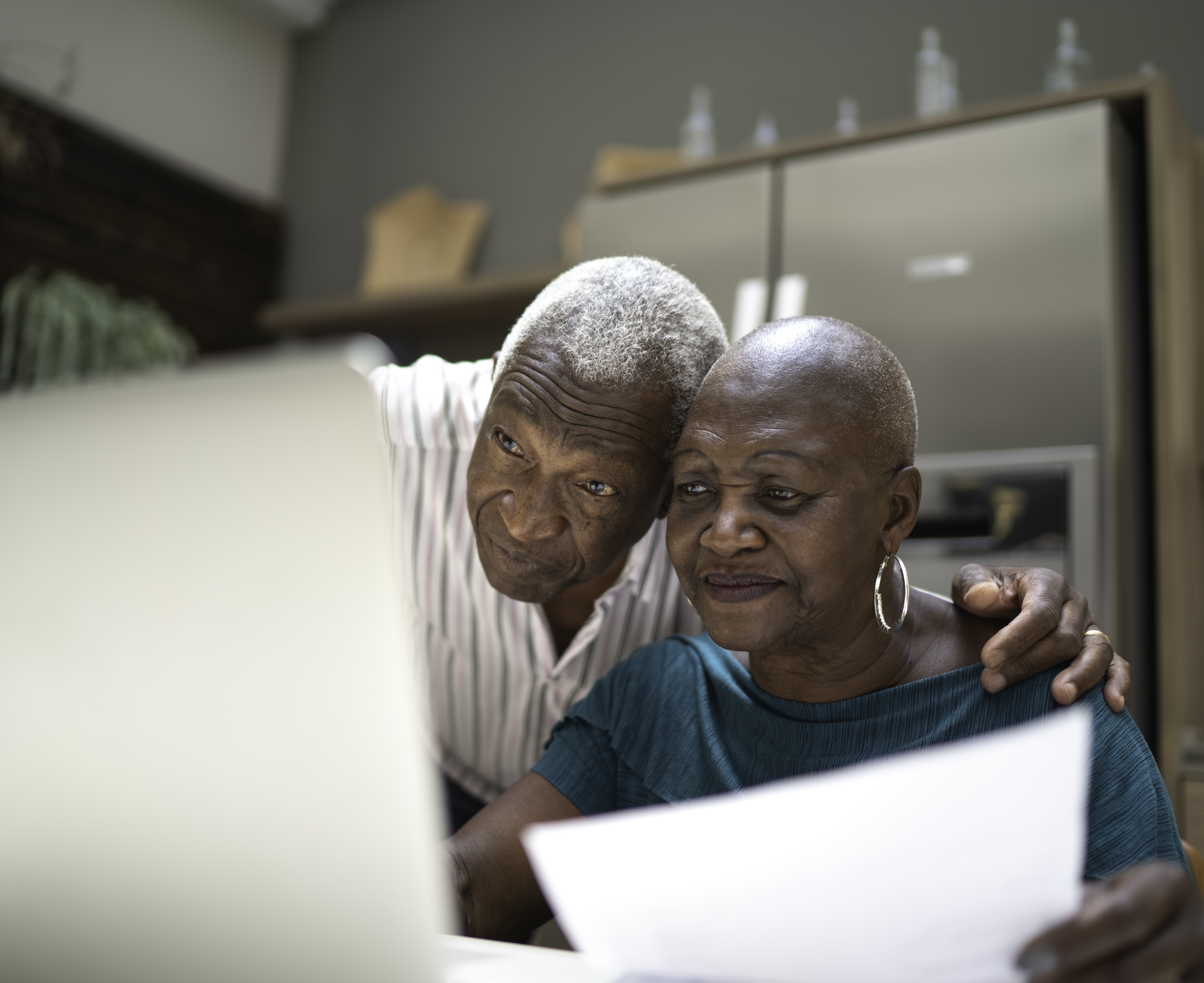 Husband And Wife Looking At Their Finances