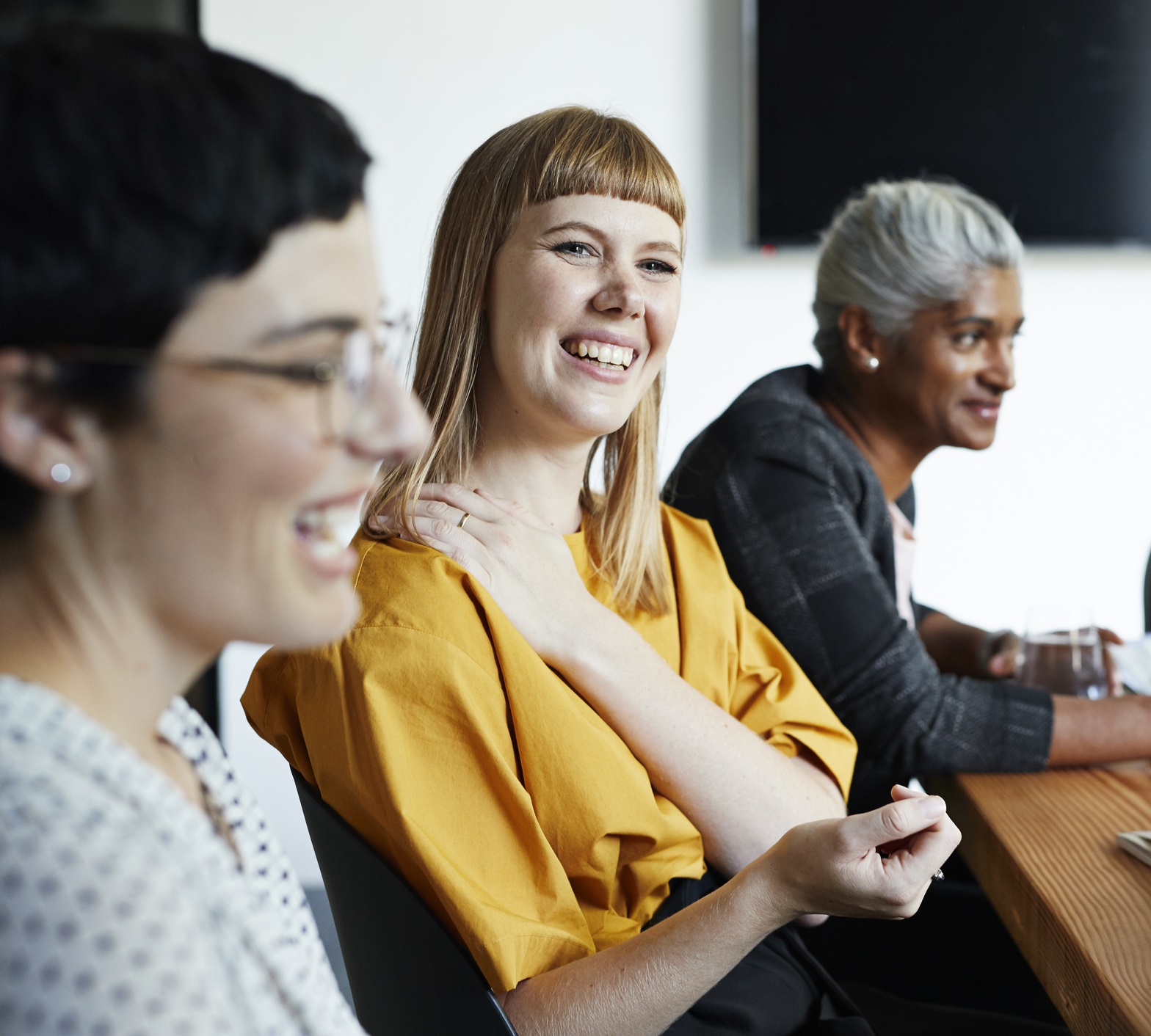 Women In A Meeting Wearing Yellow Top